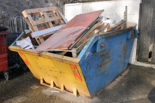 Waste removal truck in Twickenham amidst urban landscape