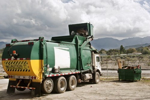 Commercial waste pile being assessed for cubic yard pricing